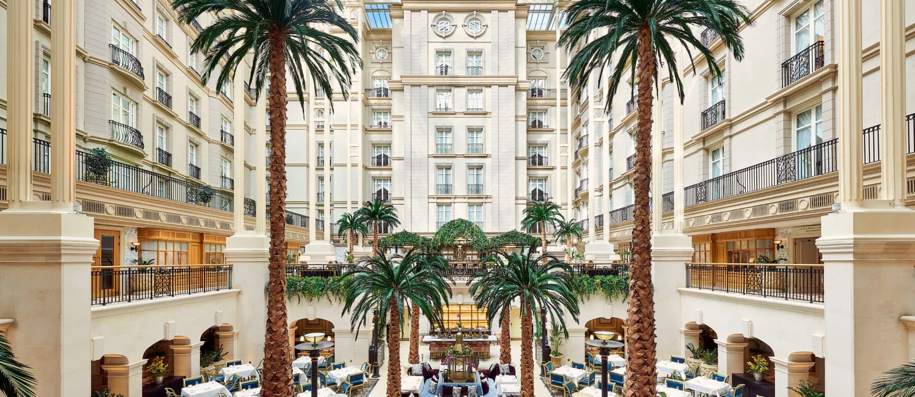 The palm-filled atrium of The Landmark London hotel