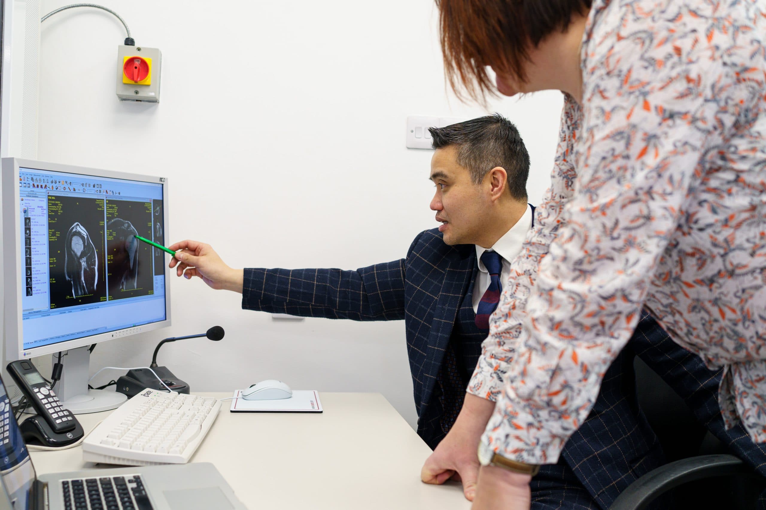 Specialist explaining MRI results during consultation